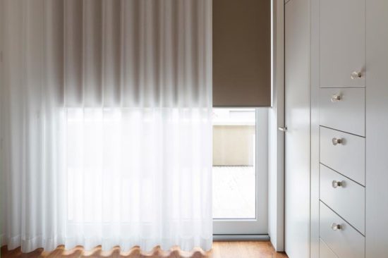 Curtain track system with blind